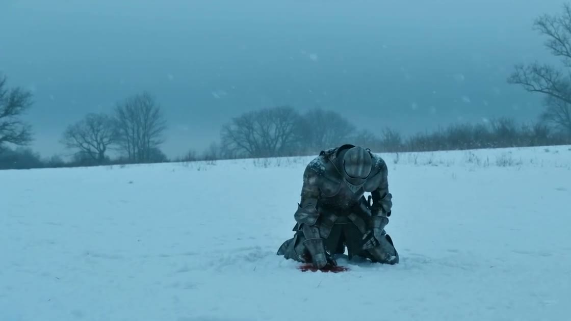A knight kneeling in a snowy field — frame from the generated video.